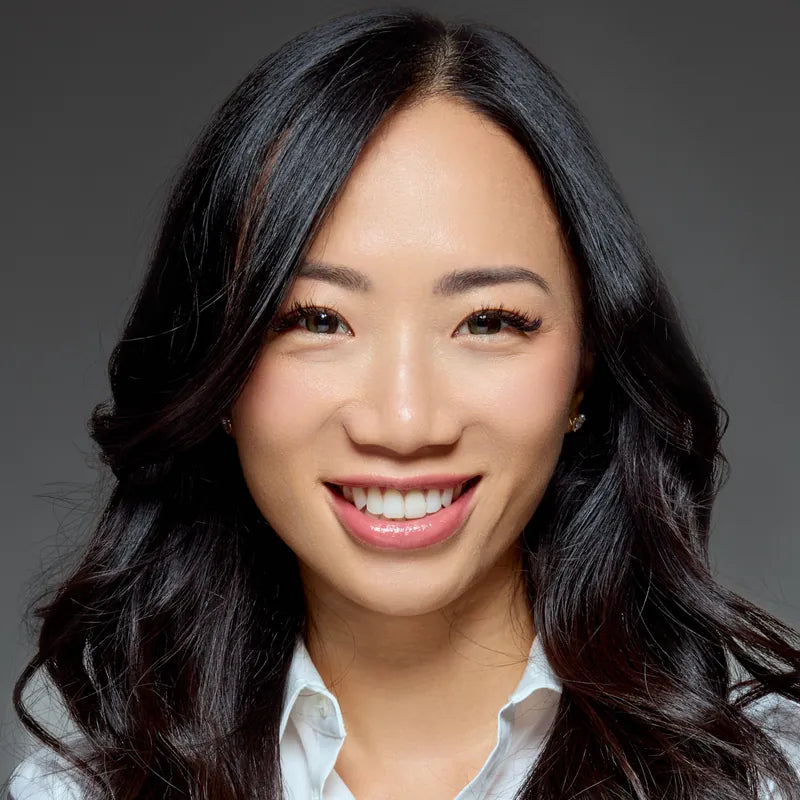 Smiling woman in a crisp white shirt