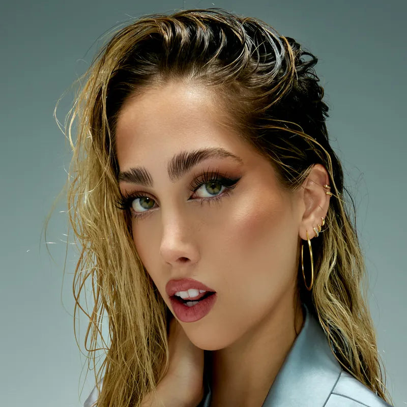 Beauty close-up with wet-look hair and green eyes